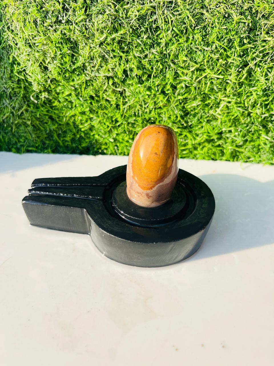 Golden Aura Narmadeshwar Shivling with Premium Black Yoni Base